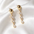 Aretes colgantes de lágrima con circonita bañados en oro de 18K | Plata de ley S925