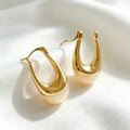 Pendientes de aro en forma de U bañados en oro de 14K | Diseño escultural